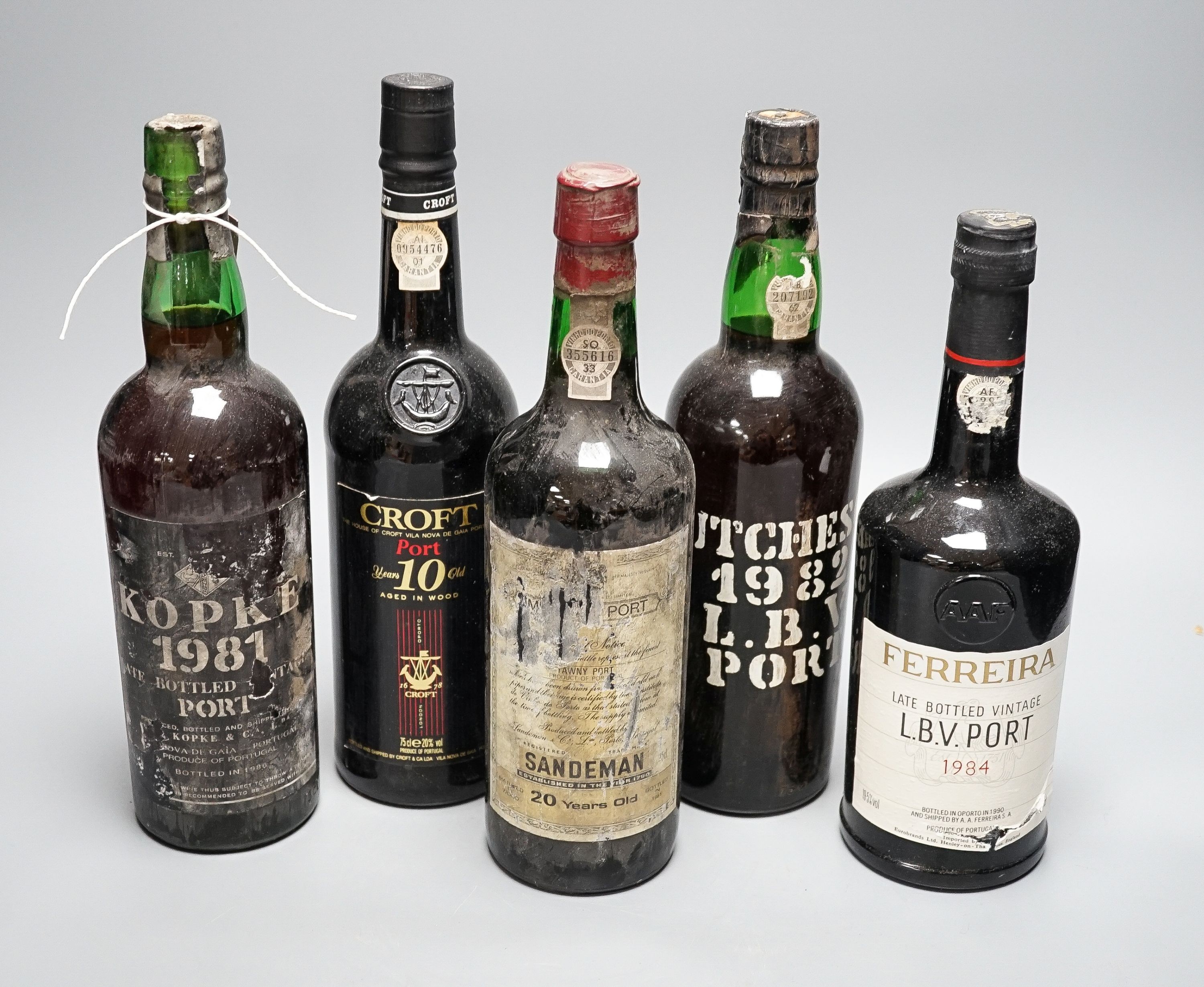 Five bottles - Kopke LBV (bottled 1986), Hutcheson LBV (bottled 1988), Feirraira LBV (bottled 1990), Croft 10 year old Tawny (bottled 1990) and Sandeman 20 year old Tawny Port (bottled 1981), all 75cl.